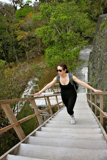 tikal guatemala climb ruins wooden staircase